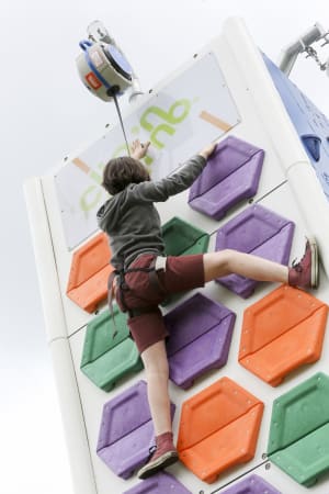 child climbing on a mobile climbing wall