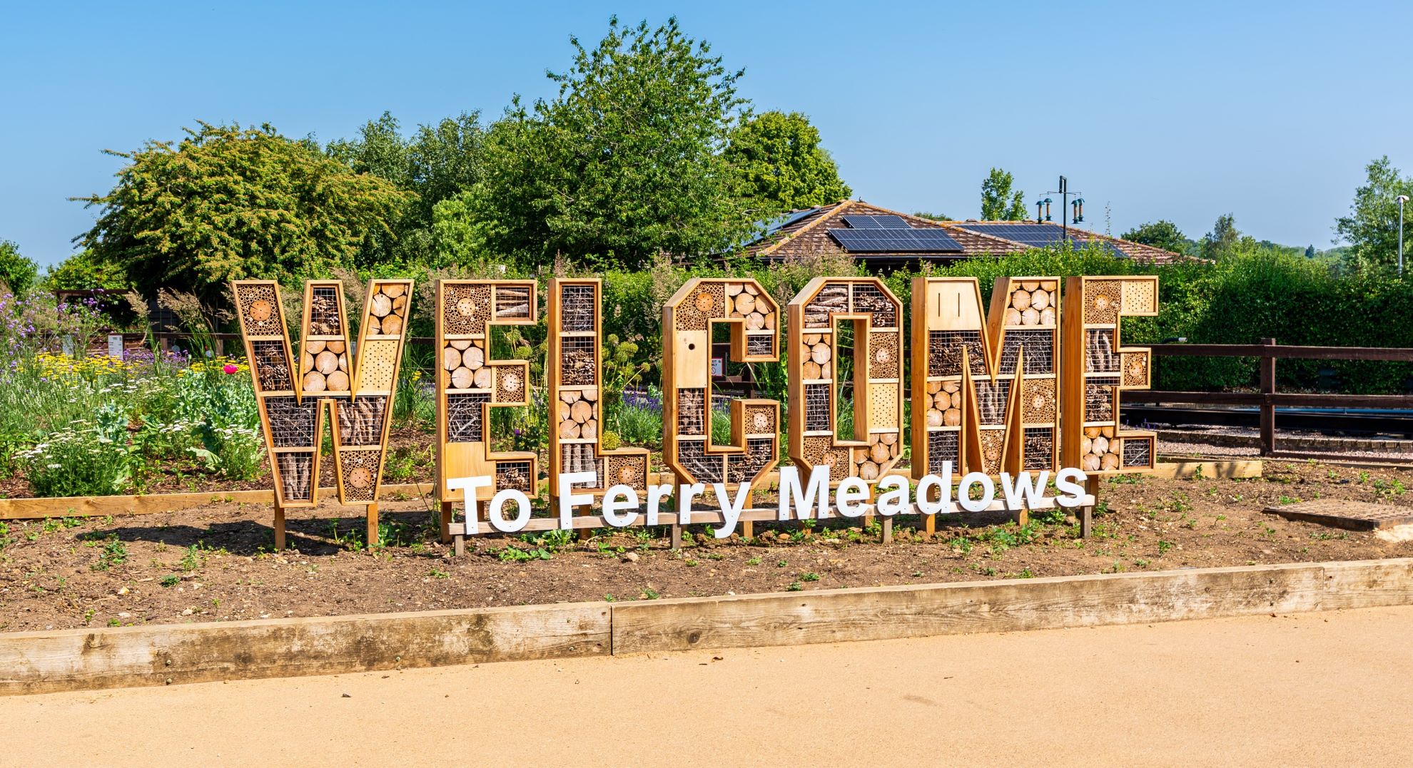 A large bug hotel designed to display the word 