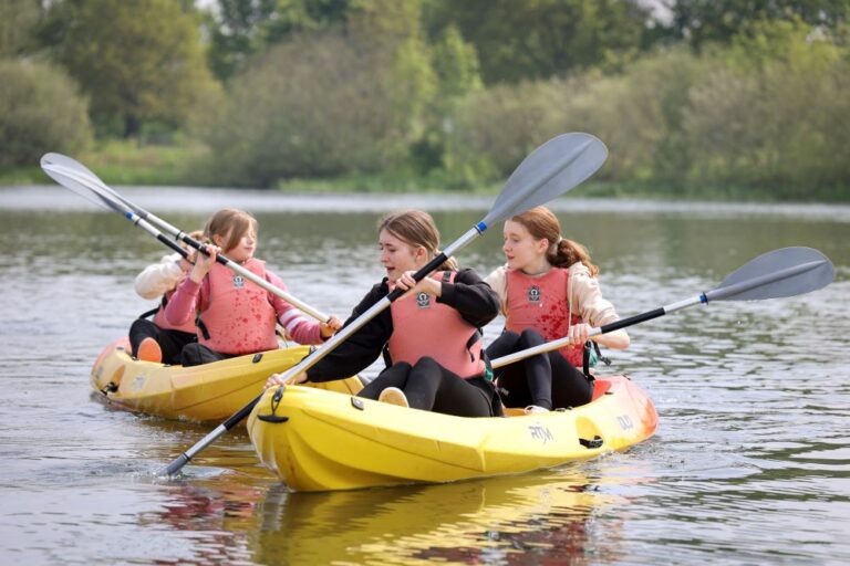 Teen girls in yellow kayaks