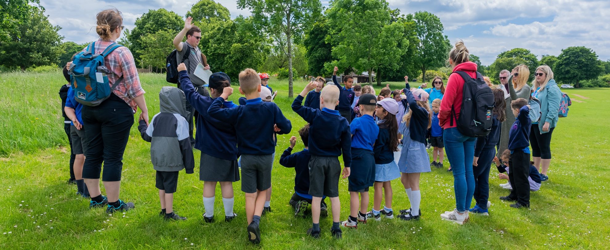 Group of primary age school children on a visit to a country park
