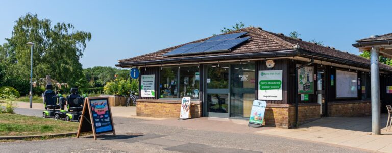 The outside of the Ferry Meadows visitor centre, a one story brick building with colourful signage outside