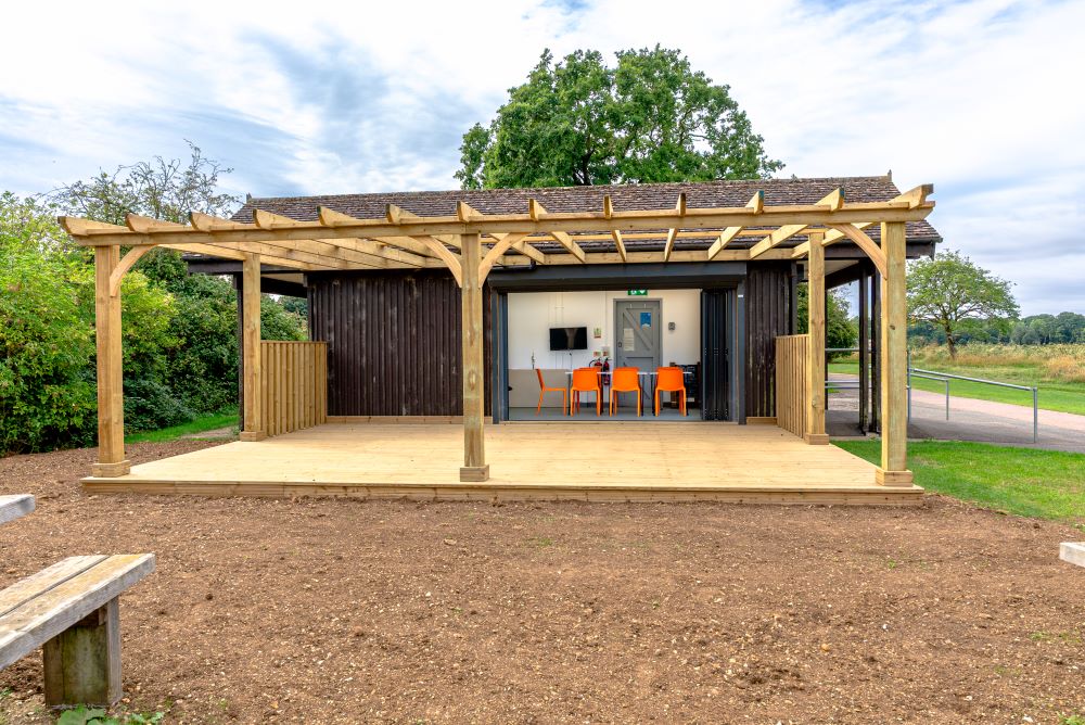 external view of Lynch Lake Community Hub wooden veranda with view into the inside space