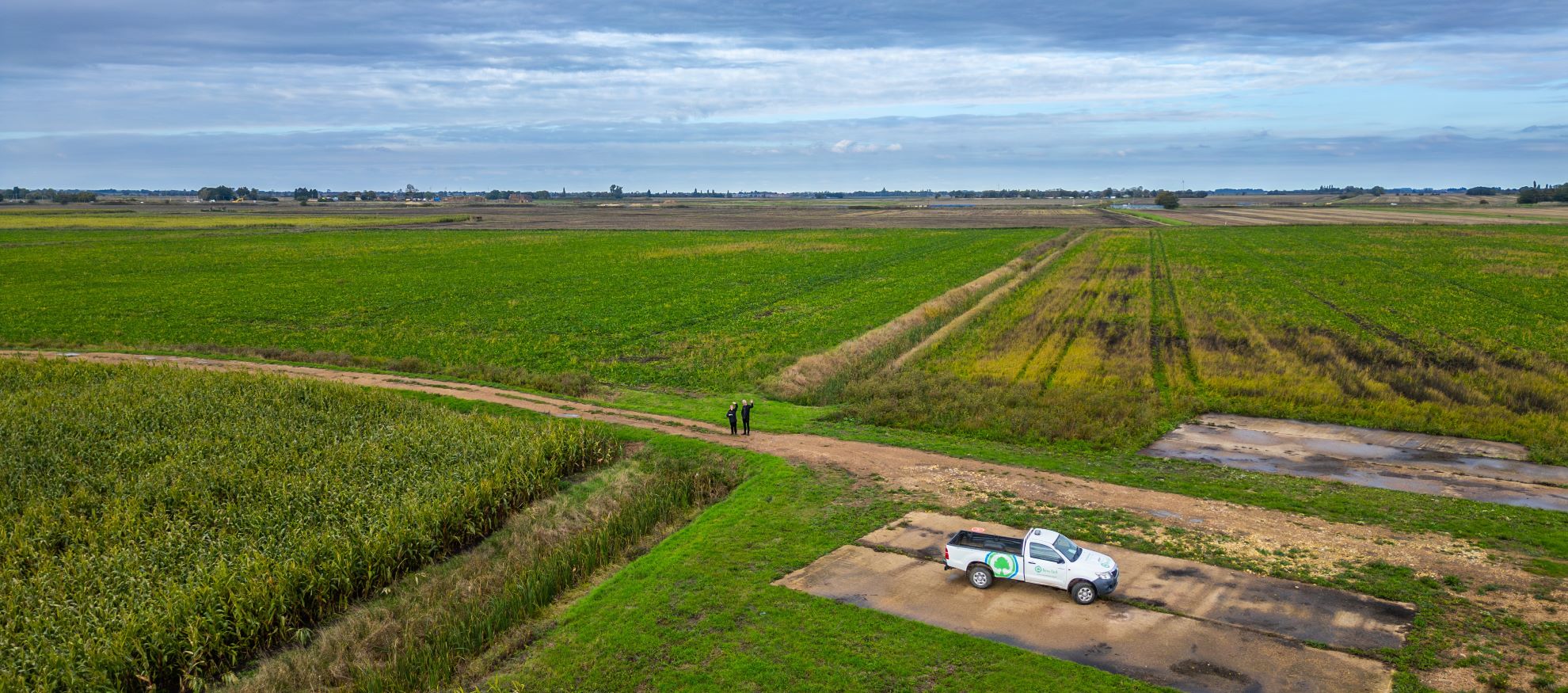 Drone view over farming fields with a blue sky