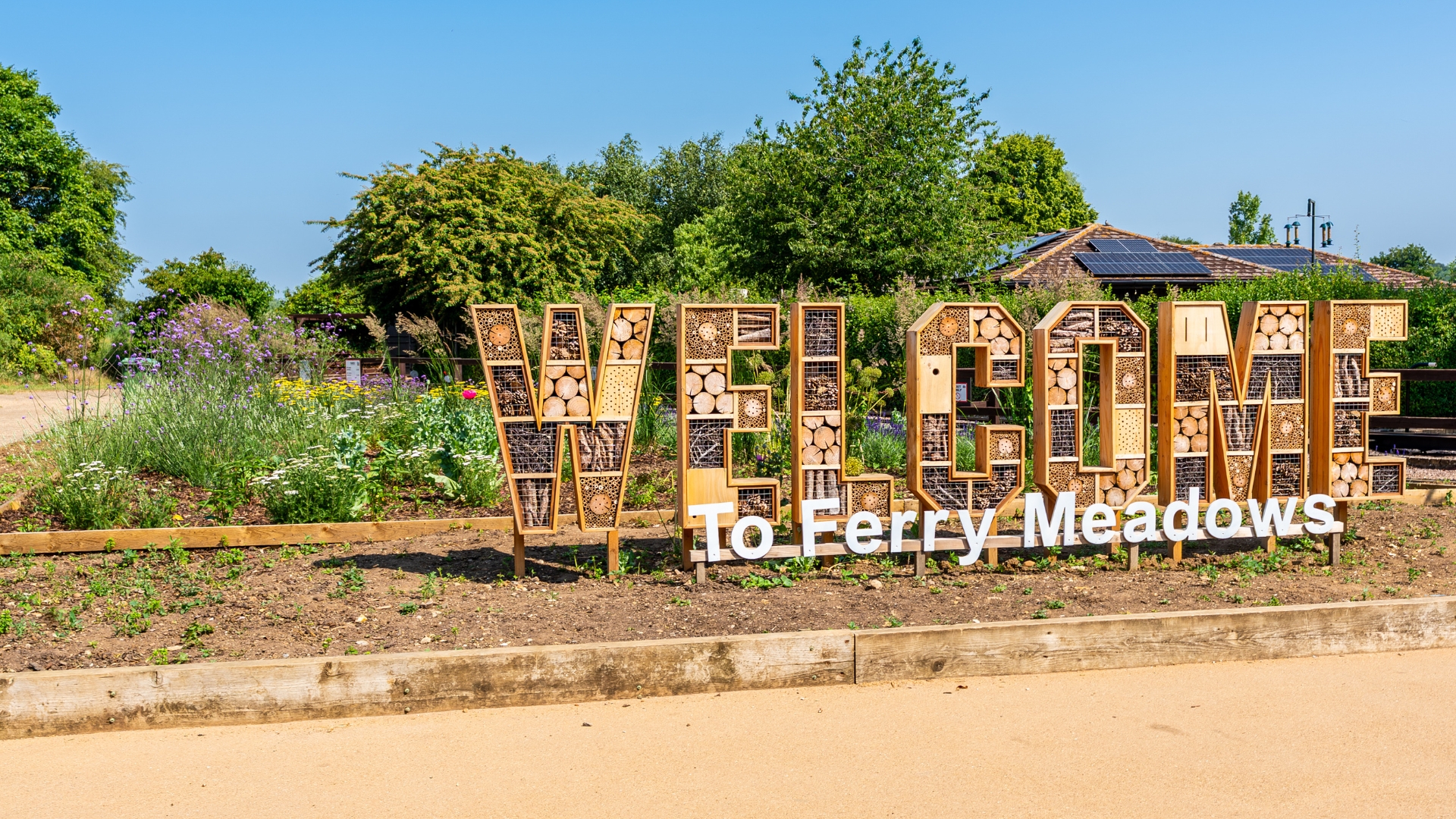 A large bug hotel designed to display the word 
