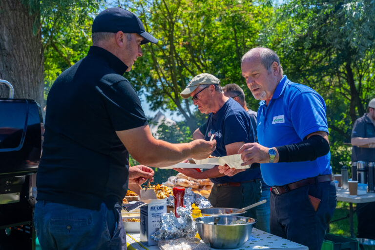 A group of volunteers having food together.