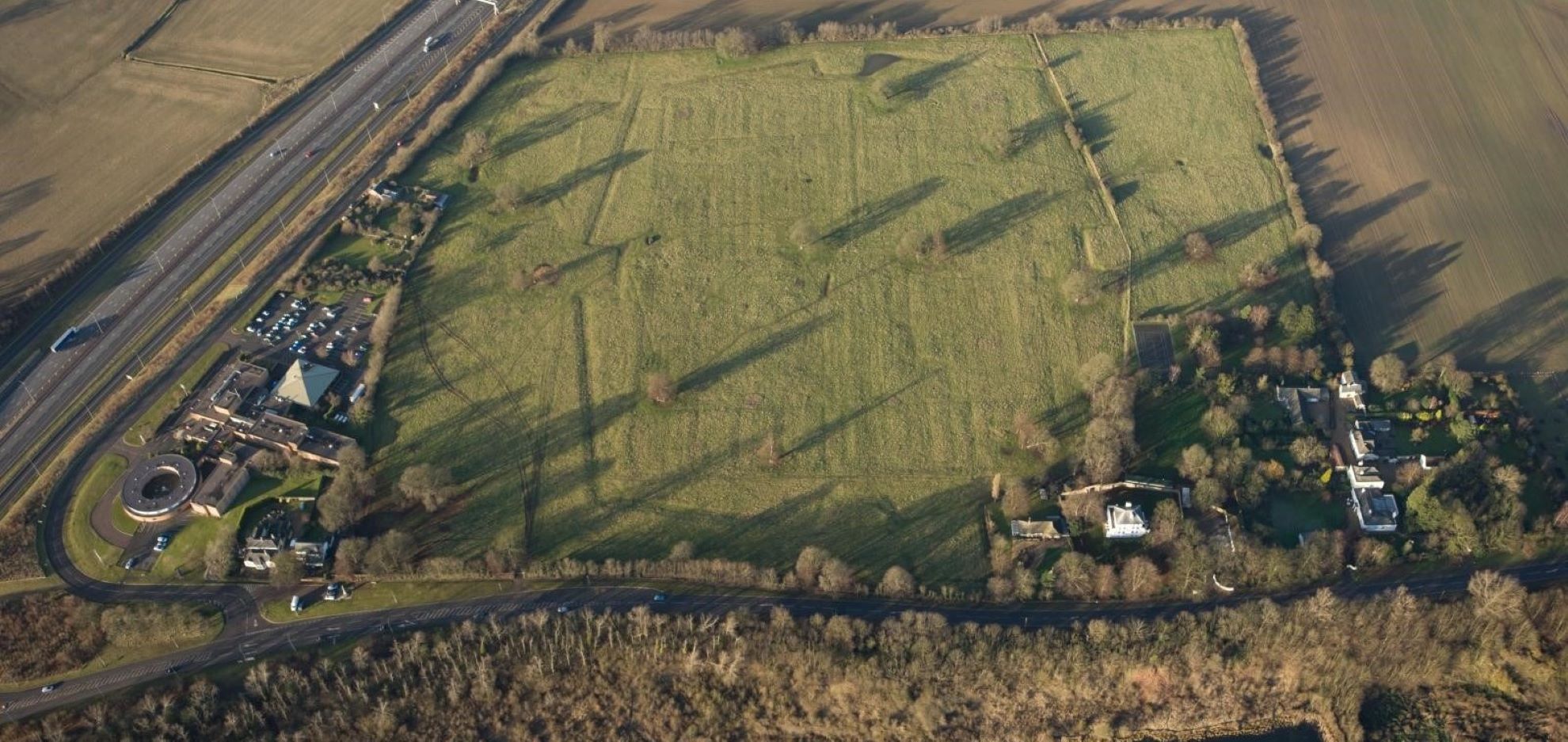 Drone view of Norman Cross fields with motorway to the left
