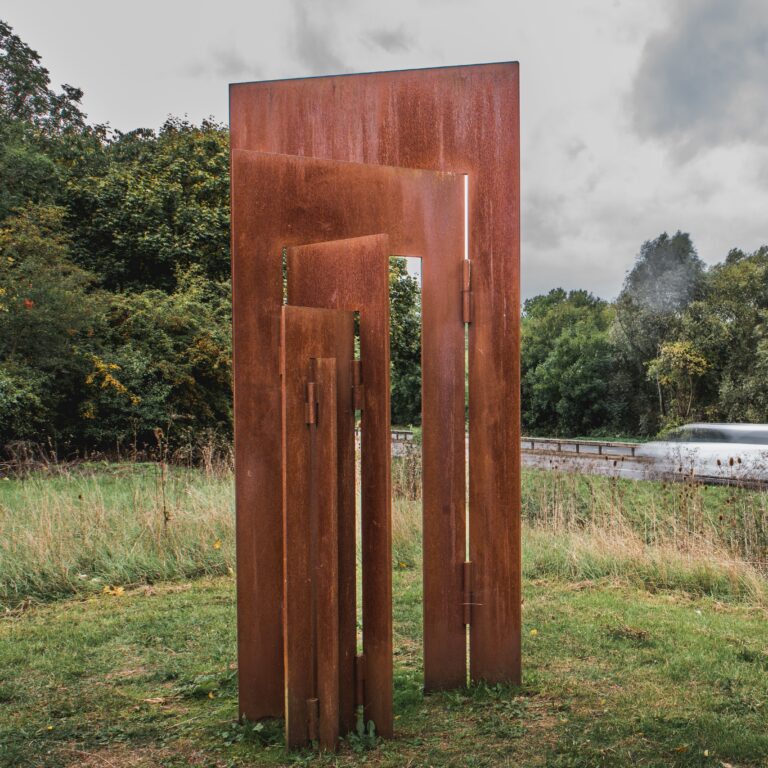 steel sculpture in a landscape setting.