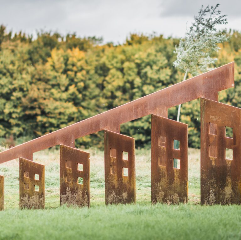 steel sculpture set in a landscape setting.