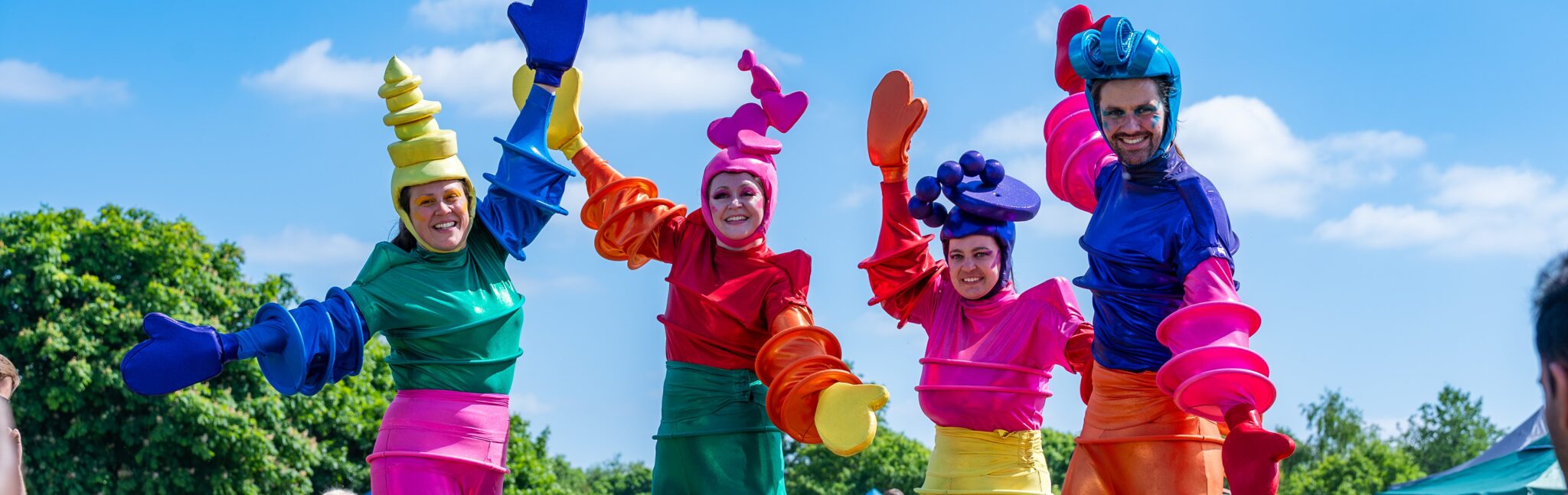 Colourful stilt walkers at a festival