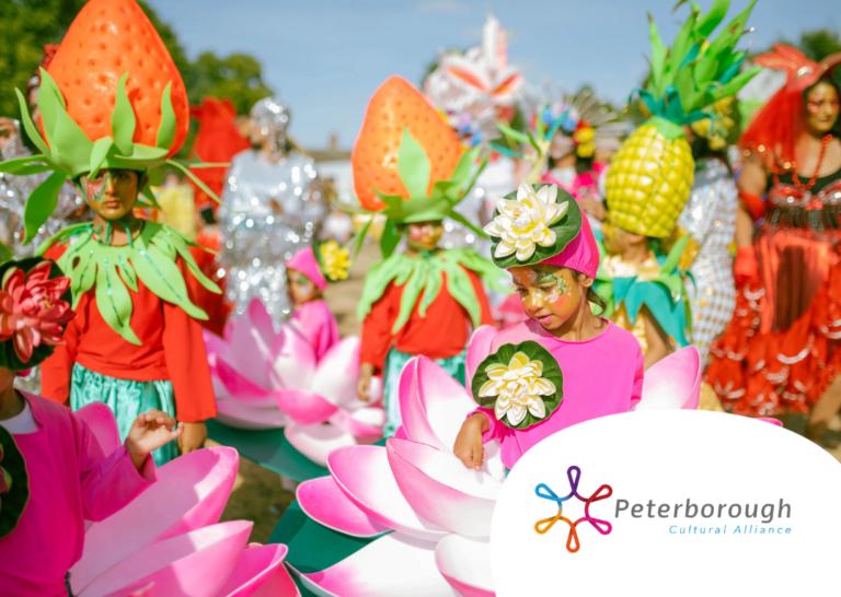 Group of people in colourful fancy dress in an outdoor setting