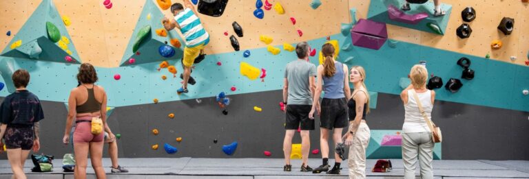 Indoor bouldering activity with families taking part