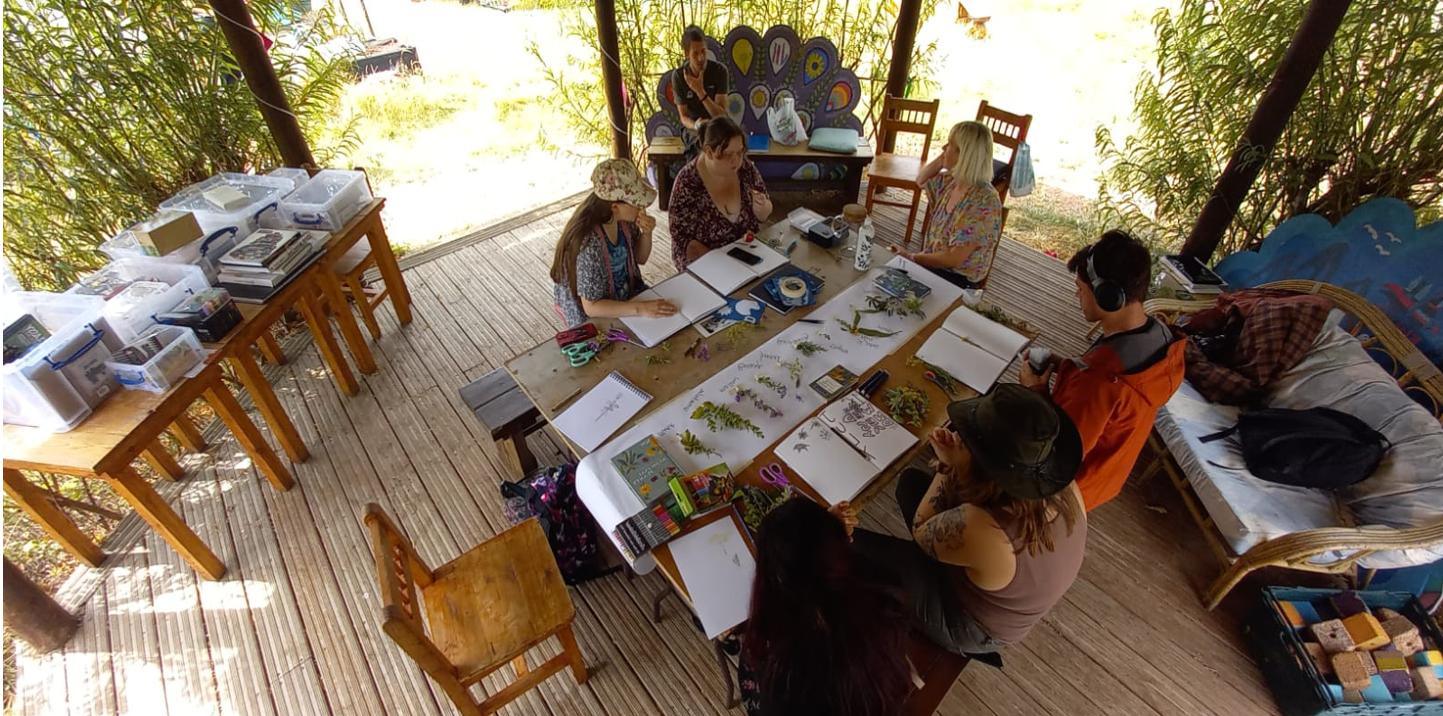 Children sitting round a table working together.
