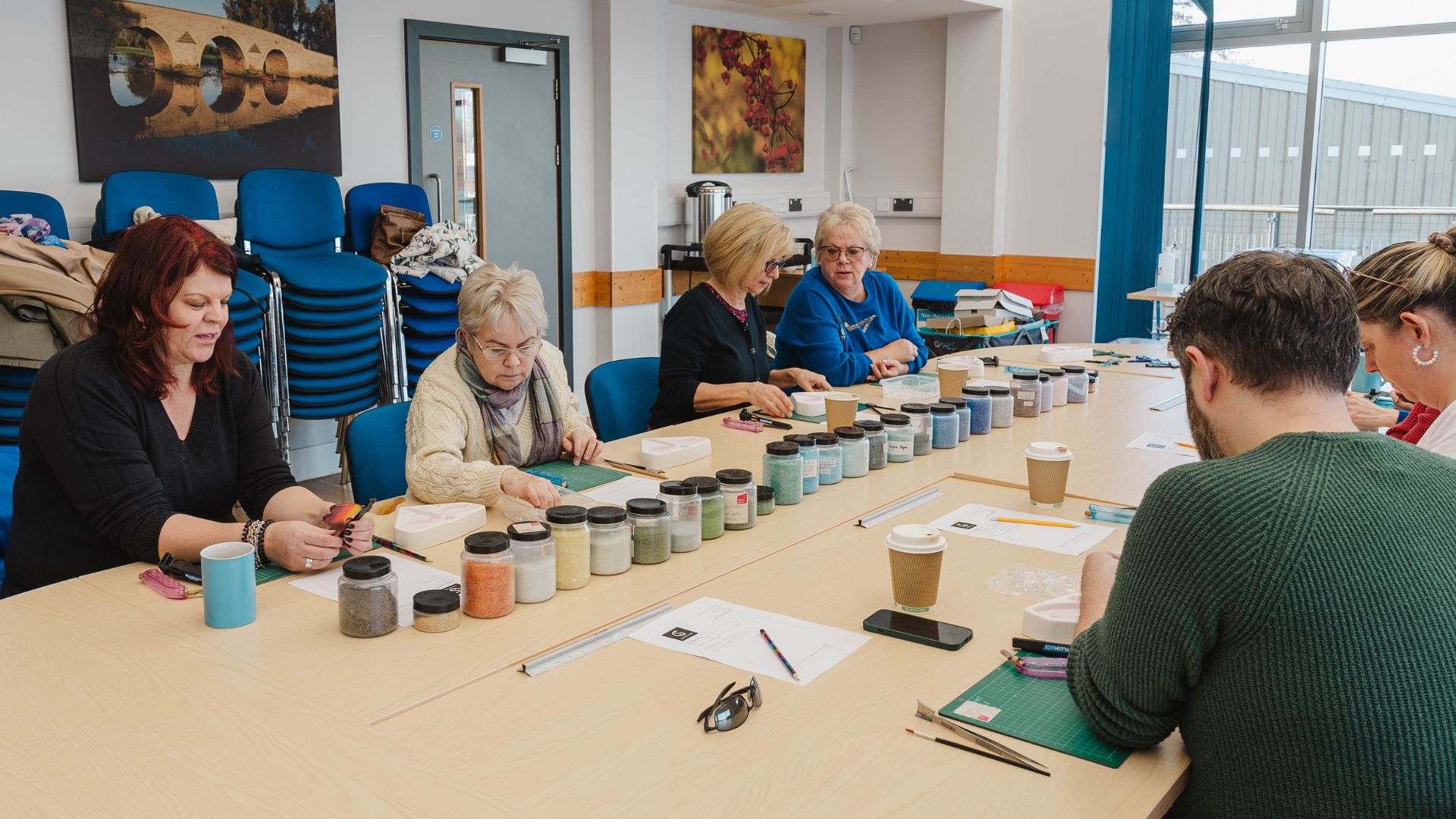 adults taking part in a fused glass craft workshop
